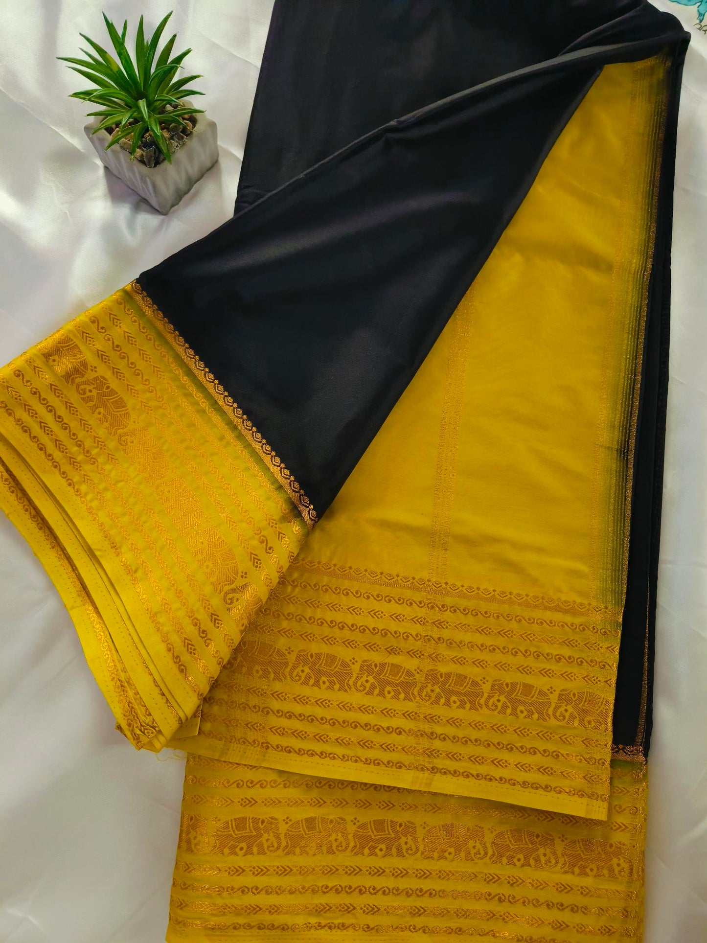 Elephant Border Black Crepe Silk Saree