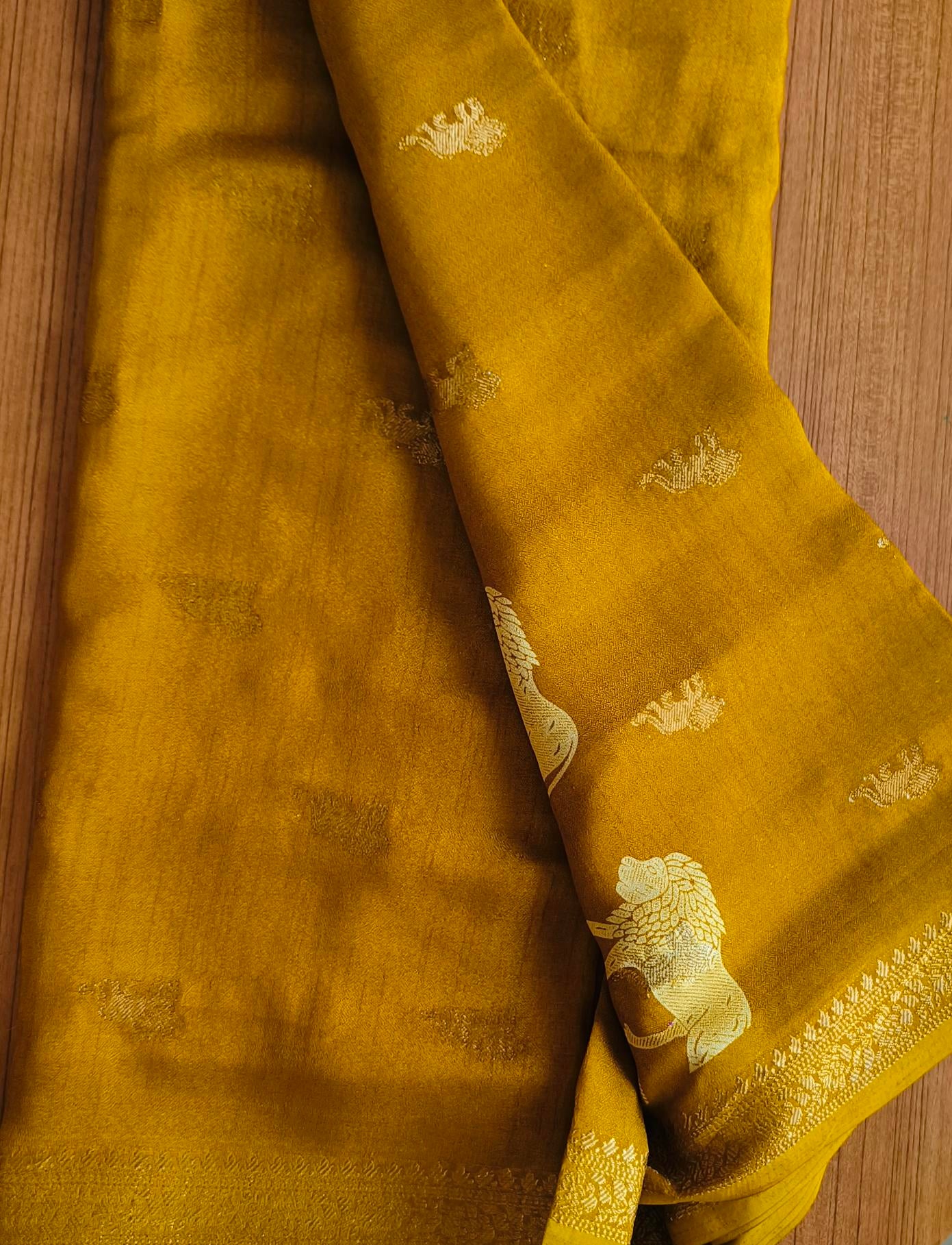 Small Border Animal Work Georgett Yellow Saree